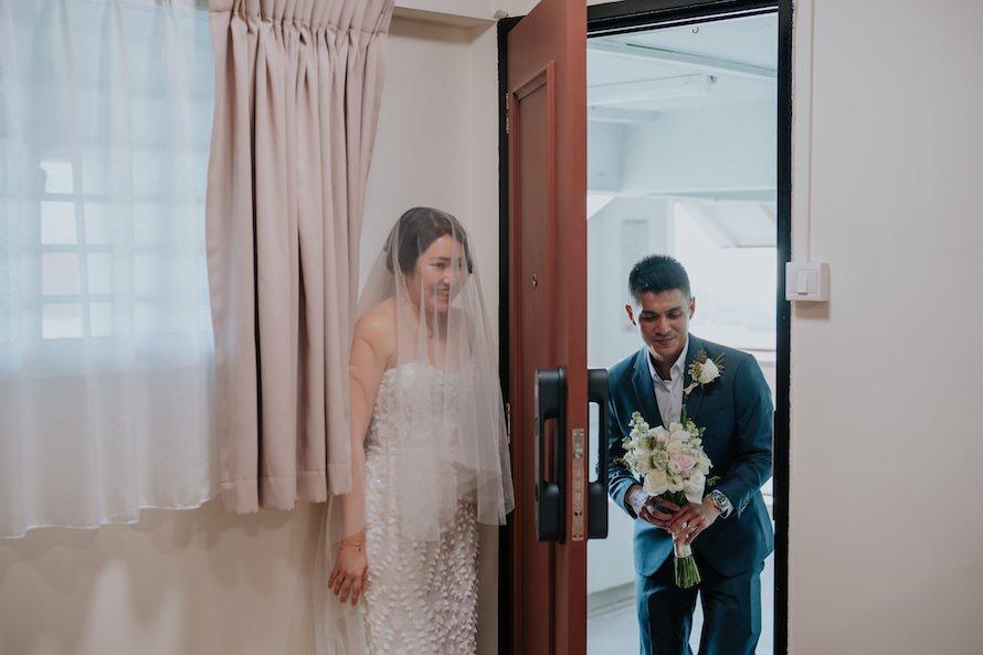 bride hiding from groom during first look
