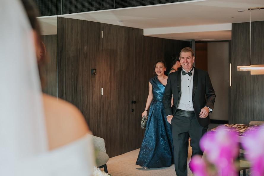 parents and daughter first look during wedding