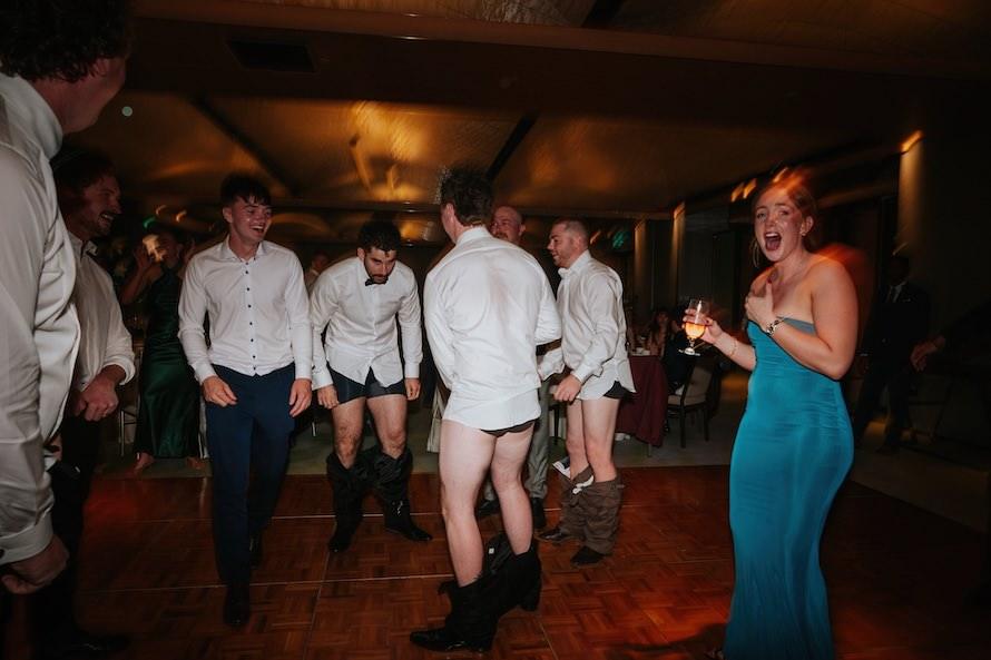 guys on dance floor with their pants off when eagle rock music came on
